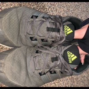 Gray ADIDAS tennis shoes with lime green logo